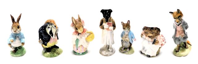 Beswick and Royal Albert Beatrix Potter figures, comprising Beswick Tommy Brock, Mrs Tiggywinkle, Bu