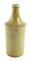A 19thC pale stoneware bottle stamped West & Co Grantham, 24cm high. (AF)