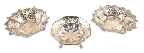 Two Victorian silver bonbon dishes, each with a pierced and flared rim, with scroll and rose decorat