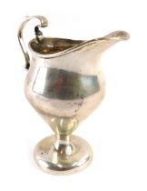 An Edward VII silver cream jug, tapered design with moulded handle, on a circular foot, maker WHS, B