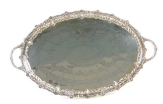 A Barraclough & Sons of Leeds Victorian silver galleried serving tray, with shell reeded handles, an
