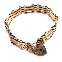 A 9ct gold gate bracelet, of four bar design with safety chain and heart shaped padlock, 16cm long,