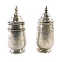 A pair of George V Walker and Hall silver pepperettes, each with a pierced top, Birmingham 1920, 2.8