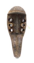 A Grebo (Krou) Maou six eyed warrior mask with fixed Jaw, Liberia, 44cm high.