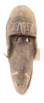 A Kran animal mask with articulated Jaw, Liberia, 61cm high.