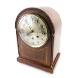 An Edwardian mahogany and boxwood strung mantel clock, the arched case with gilt metal mounts, silve