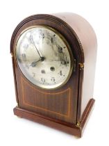 An Edwardian mahogany and boxwood strung mantel clock, the arched case with gilt metal mounts, silve