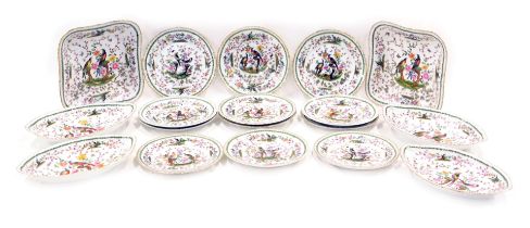 An early 20thC Chelsea porcelain dessert service, heavily decorated with flowers and exotic birds, c