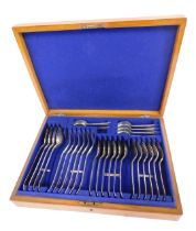 A canteen of Old English silver plated cutlery, oak case.