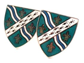 A pair of Thomas Fattorini silver and enamel cufflinks, each shaped as a shield, with turquoise, whi