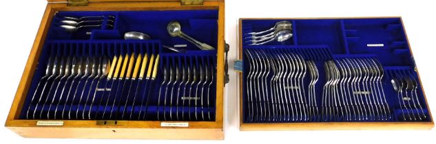 A part silver plated fiddle pattern canteen of cutlery, the oak case labelled for Goldsmiths and Sil