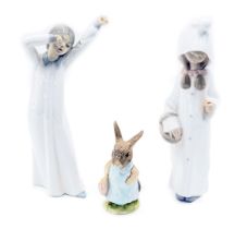 Three ceramic figures, comprising a Lladro figure of a girl carrying basket, 21cm high, a Nao figure