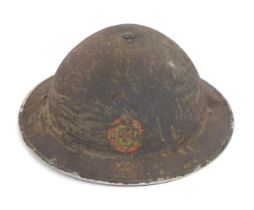 A Fire Service tin hat, with printed emblem (AF).
