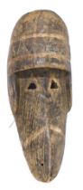 A Krahn (Kru) large warrior 'angry animal' mask, with Kaogle eyes/moveable jaw, Liberia, 61cm high.