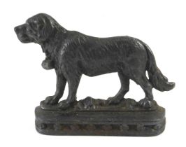 A cast iron door stop, modelled in the form of a St Bernard, 23cm wide.