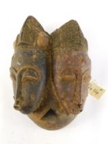 A Baule Old 'Janus' two faced portrait mask (Mblo), Cote D'Ivoire, 40cm high.