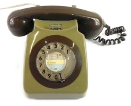 A two tone brown plastic vintage telephone, 24cm wide.