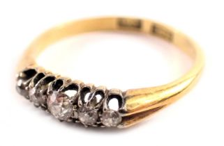 A diamond set dress ring, the ring set with five old cut diamonds, each in a platinum claw setting o