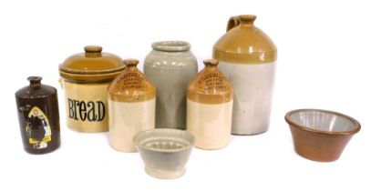 A quantity of stoneware, to include flagons labelled H Sandall Grimsby, jelly mould, etc.