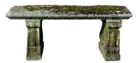 A reconstituted stone garden bench, the scroll end supports, on a rectangular top, 44cm high, 107cm