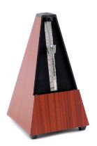 A cased metronome, 22cm high.
