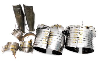 A quantity of replica Roman style armour, a pair of bronzed leg guards, etc.