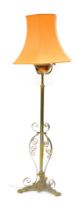 A late 19thC cast and wrought brass adjustable floor lamp, with copper reservoir, previously an oil