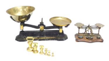 Brassware, comprising a set of 19thC metal and brass tabletop scales, and a set of Sovereign scales