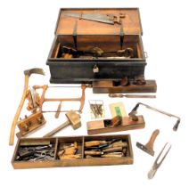 A 19thC black painted pine ships carpenter's tool chest and contents, to include wood block planes,