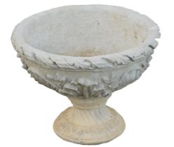 A reconstituted stone acanthus leaf garden urn, with a fluted border and shell Neoclassical scroll d