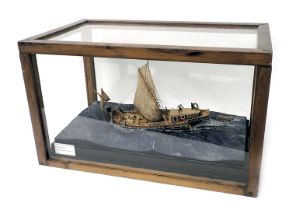 A diorama and scale model of a Roman merchant ship, in stained pine and perspex case, 85cm wide.