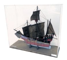 A scale model of the three masted ship The Santa Maria, painted in red, blue and gold, in fitted per