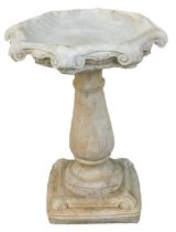 A reconstituted stone Gothic style birdbath, with hexagonal top, on tapered stem, on square foot, 66