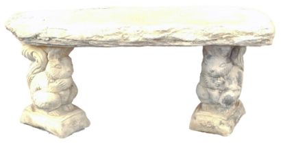 A reconstituted stone garden bench, on squirrel design plinths, on straight seat, 43cm high, 93cm wi