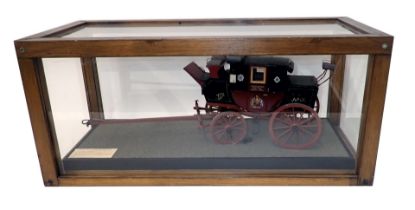 A scale model of the Doncaster to Halifax mail coach, decorated in dark red and black livery with cr