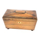 A 19thC oak tea caddy, the canted top with reeded border and brass lock plate on bun feet, 21cm high