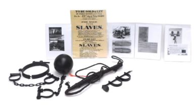 A quantity of display models relating to slavery, to include handcuffs, leather whip, ball and chain