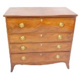 A late George III mahogany secretaire chest, the top with rounded corners and a moulded edge above a