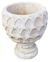 A reconstituted stone pineapple urn deep planter, pineapple pattern, on a circular base, 47cm high.