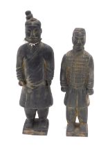 A pair of tomb style figures, each modelled as Oriental gentlemen, 29cm and 26cm high. (2)