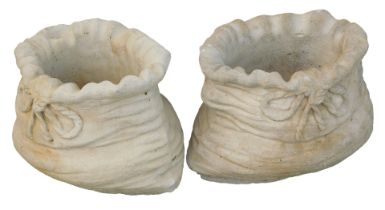 A pair of small sack shaped planters, each with a fluted top and bow, 26cm high, 31cm wide. (2)