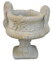 A reconstituted stone two handled urn planter, in the Neoclassical style, on a circular foot, 50cm h