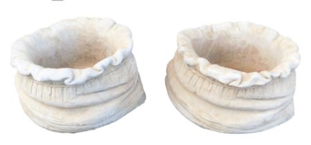 A pair of large sack shaped planters, each with a fluted top and bow design, 24cm high, 41cm wide. (