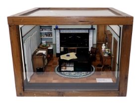 A scale model of a Morrison shelter, containing furniture, cooking range, etc., in pine and perspex