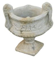 A reconstituted stone two handled urn planter, in the Neoclassical style, on a circular foot, 50cm h