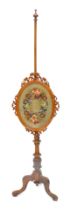 A Victorian walnut pole screen, the oval banner with raised woolwork and beaded design of flowers, o