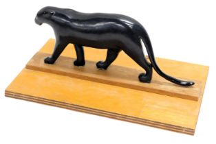 A composition bronze effect sculpture of a panther, 40cm wide, in a fitted case.