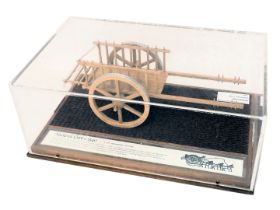 A scale model of a Medieval cart circa 1840, in glazed perspex case, 44cm wide.