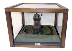 A diorama model of a Roman watch tower, with surrounding ditches, etc., in wood and perspex case, 47