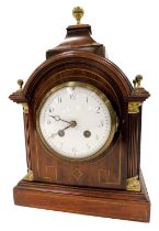 A 19thC mahogany mantel clock, with turret top and column supports, with brass string inlay and a wh